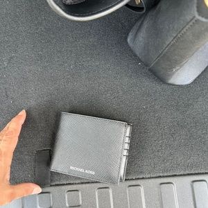 Man’s new mk wallet with tags